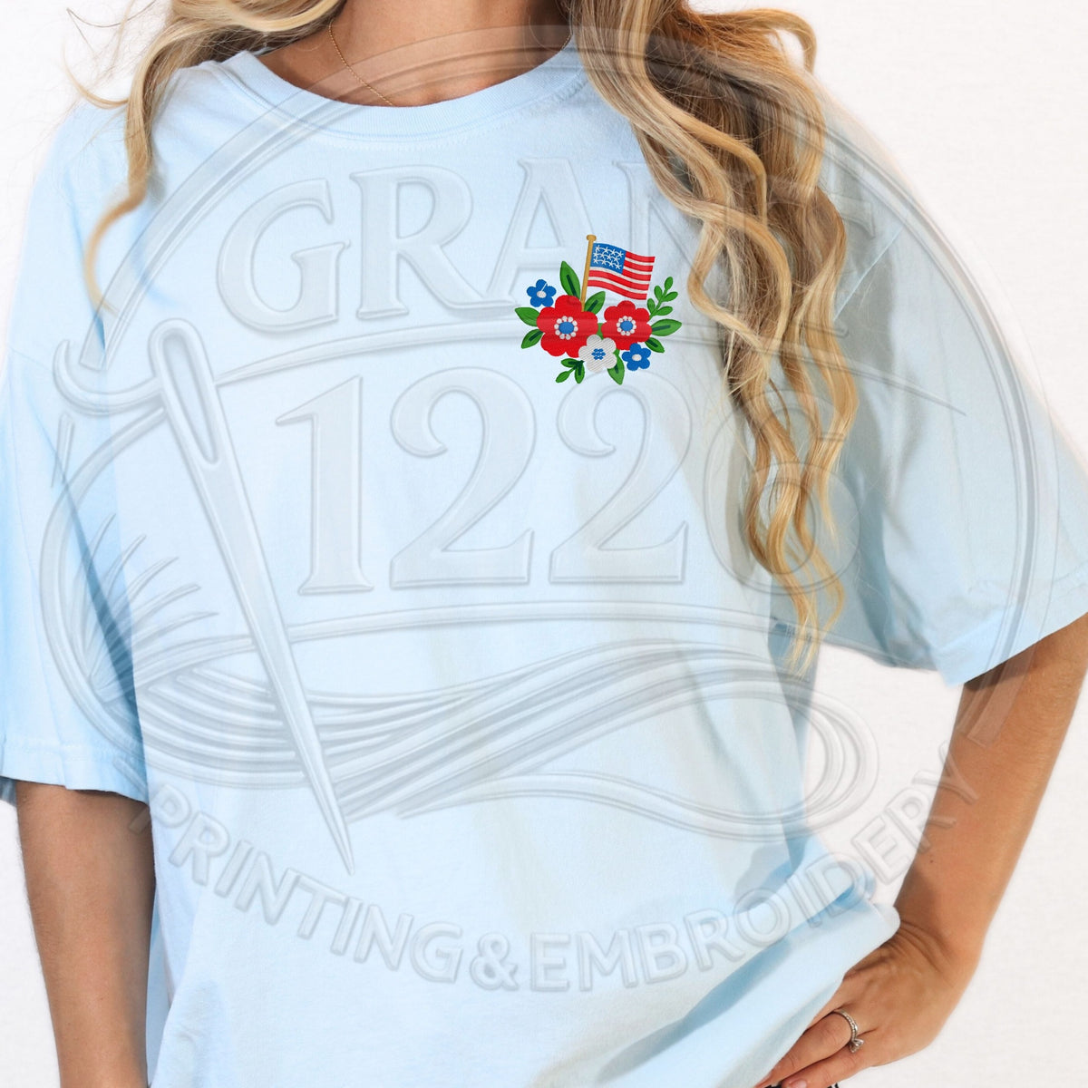 Light blue patriotic T-shirt with small floral flag embroidery