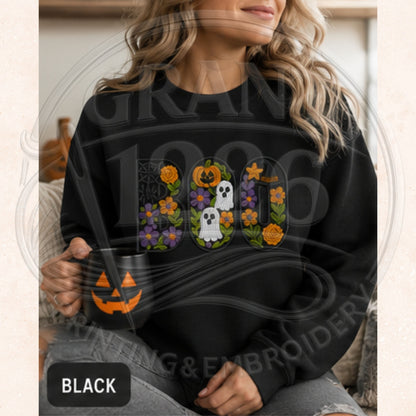 Black adult crewneck sweatshirt with floral BOO embroidery featuring ghosts, pumpkins, flowers, and a witch hat