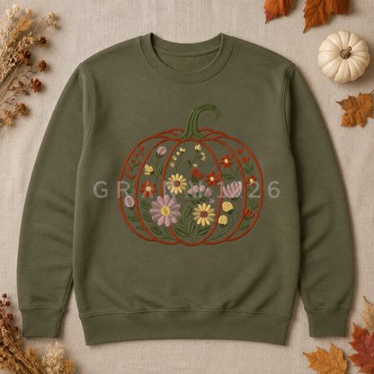 Military Green Gildan Softstyle sweatshirt with centered floral garden pumpkin embroidery in an autumn flat lay