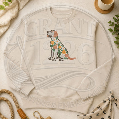 Ivory crewneck sweatshirt featuring a floral embroidered Labrador Retriever design in a dog themed flat lay.