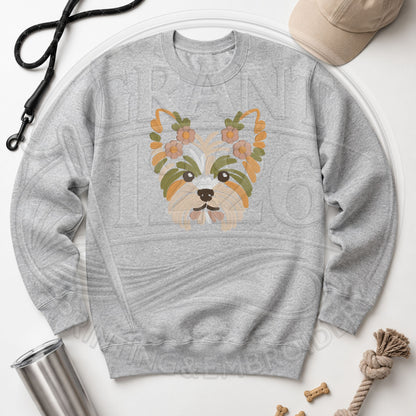 floral Yorkie embroidery on Gildan Softstyle Ash crewneck flat lay