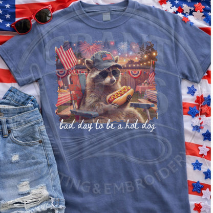 Patriotic raccoon graphic tee with fireworks and hot dog design
