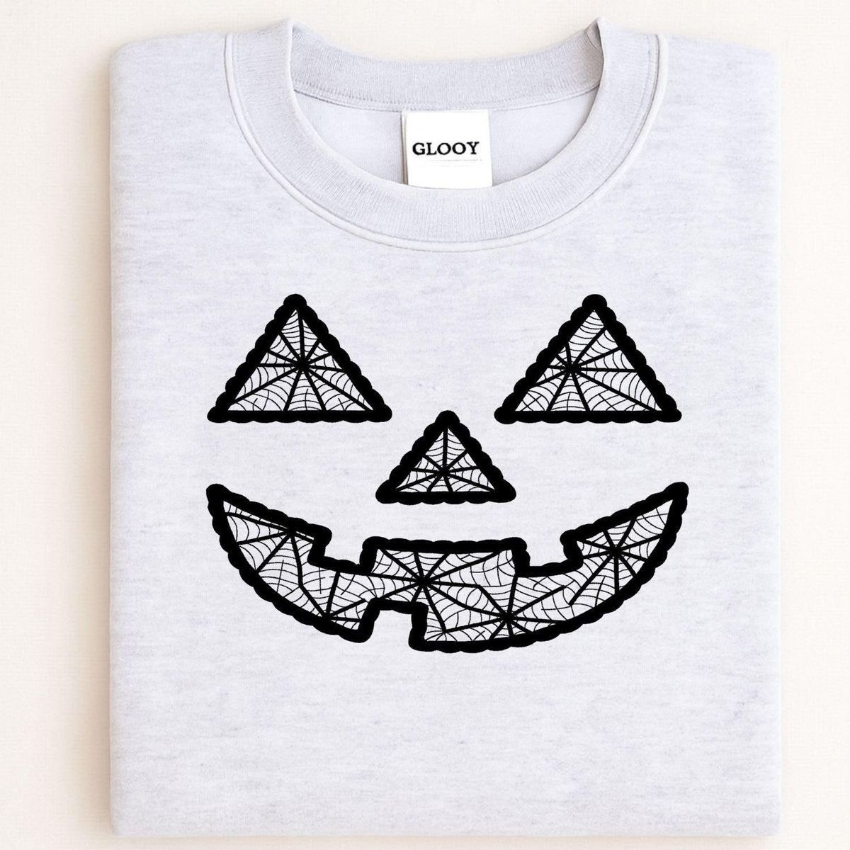 Folded ash gray crewneck with black geometric pumpkin face embroidery