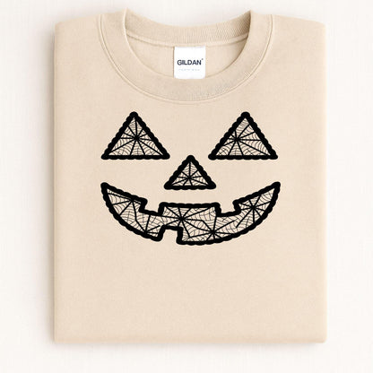 Folded sand crewneck with black geometric jack-o-lantern embroidery