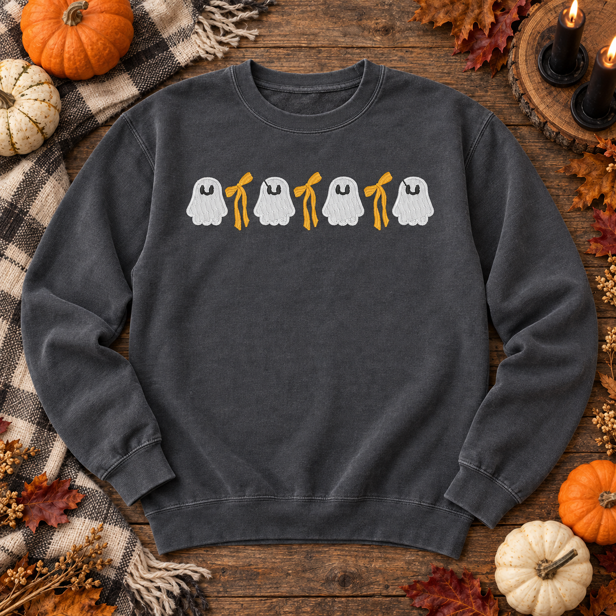 Pepper ghost and bow embroidered sweatshirt flat lay with pumpkins and Halloween styling