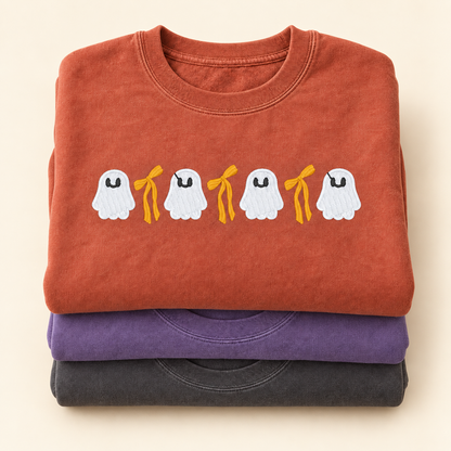 Folded Pepper Violet and Terracotta ghost and bow sweatshirts shown together