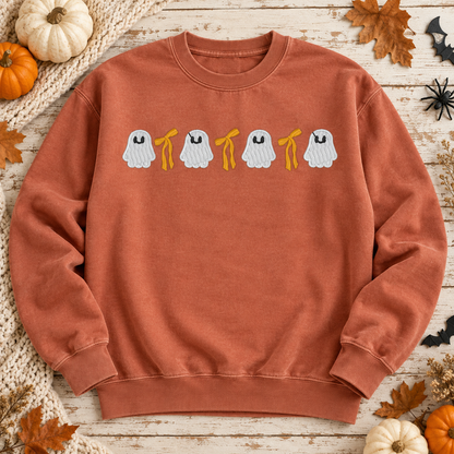 Terracotta ghost and bow embroidered sweatshirt flat lay with autumn Halloween decor