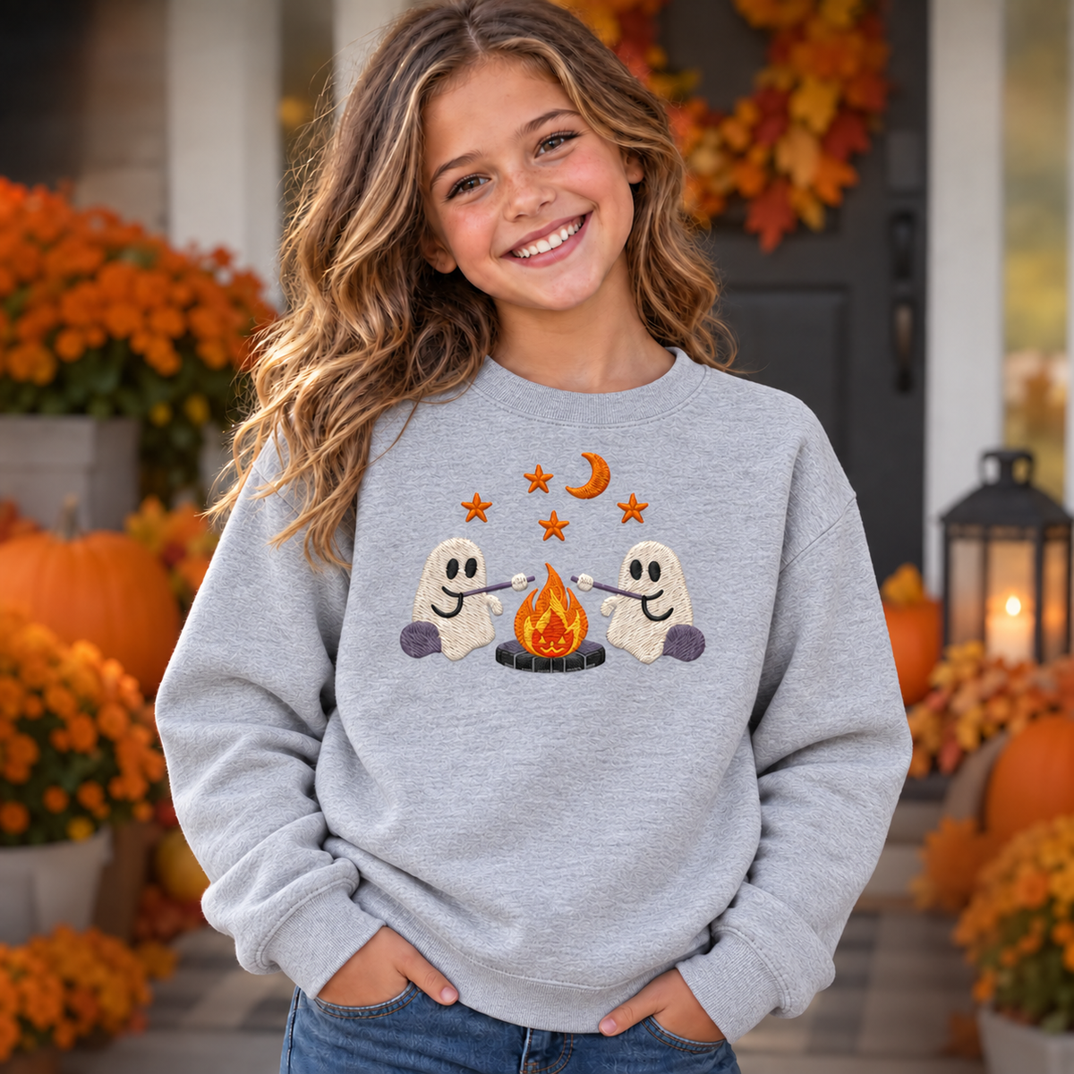 Girl wearing Sport Grey youth embroidered ghost campfire sweatshirt