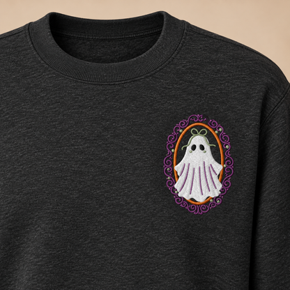 Cropped upper-chest view showing the collar, shoulder seam, and true left-chest placement of the framed ghost embroidery.