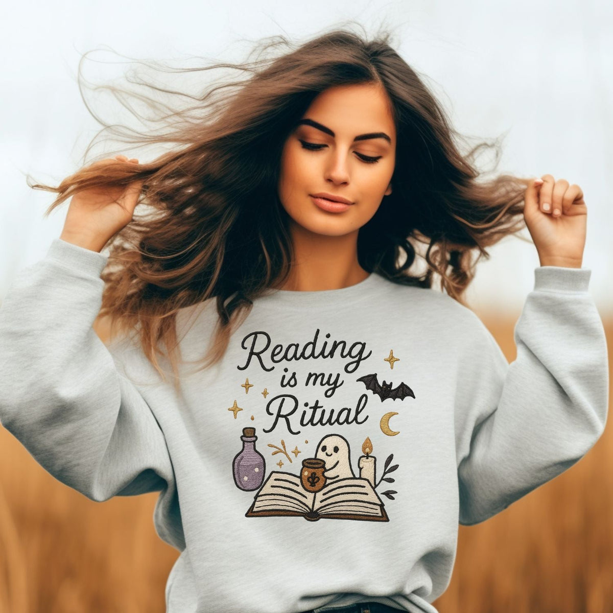 Ash embroidered reading sweatshirt with ghost, open book, candle and potion details