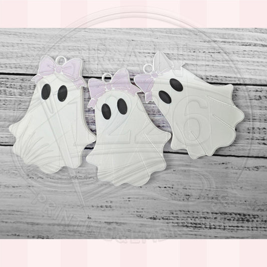 Three 3D printed ghost soda can tab openers with pastel bows