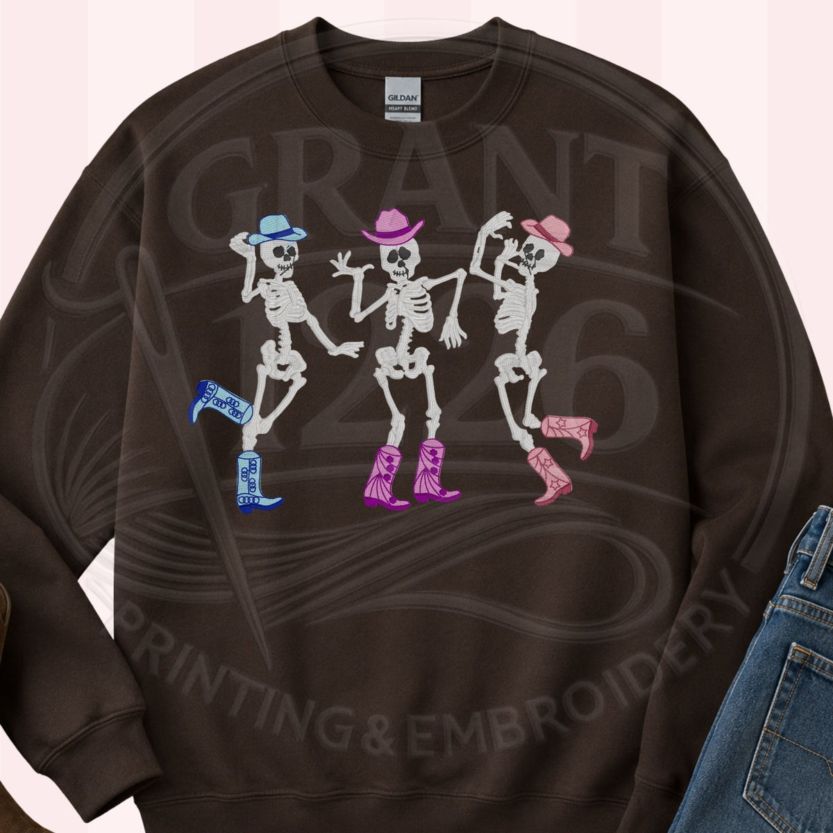 Dark Chocolate western Halloween sweatshirt with three embroidered dancing cowgirl skeletons