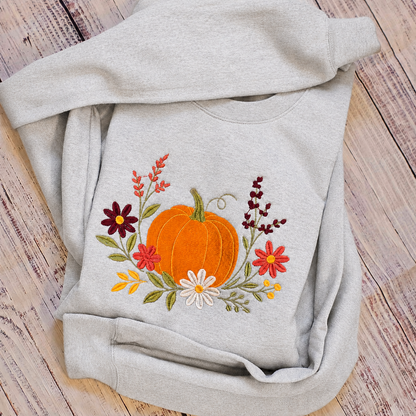 Ash floral pumpkin embroidered Gildan Softstyle sweatshirt folded view