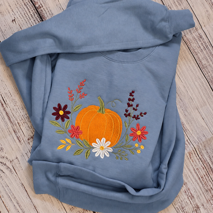 Stone Blue floral pumpkin embroidered Gildan Softstyle sweatshirt folded view