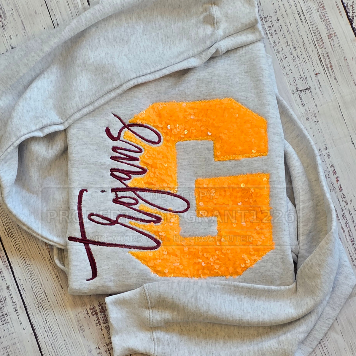 Sport Grey Girard Trojans sweatshirt with a gold sequin G and burgundy script embroidery