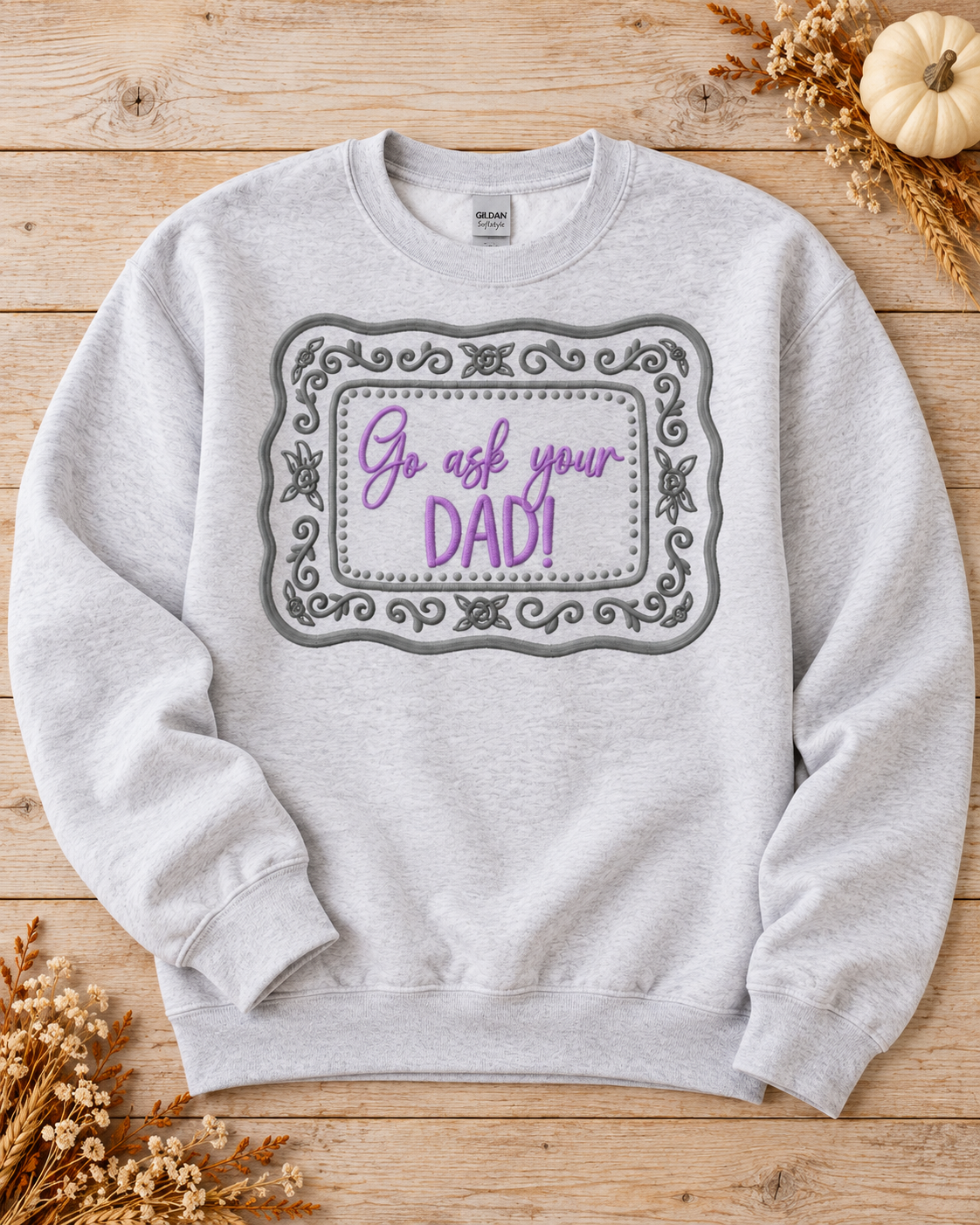 Ash Gildan Softstyle Go Ask Your Dad embroidered sweatshirt flat lay with lavender and grey thread