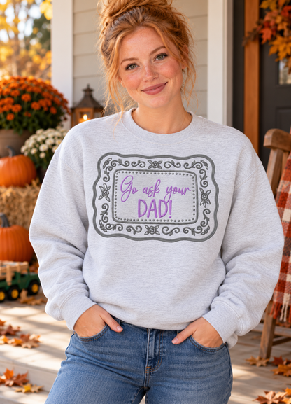 Woman modeling Ash embroidered Go Ask Your Dad crewneck on a farmhouse porch