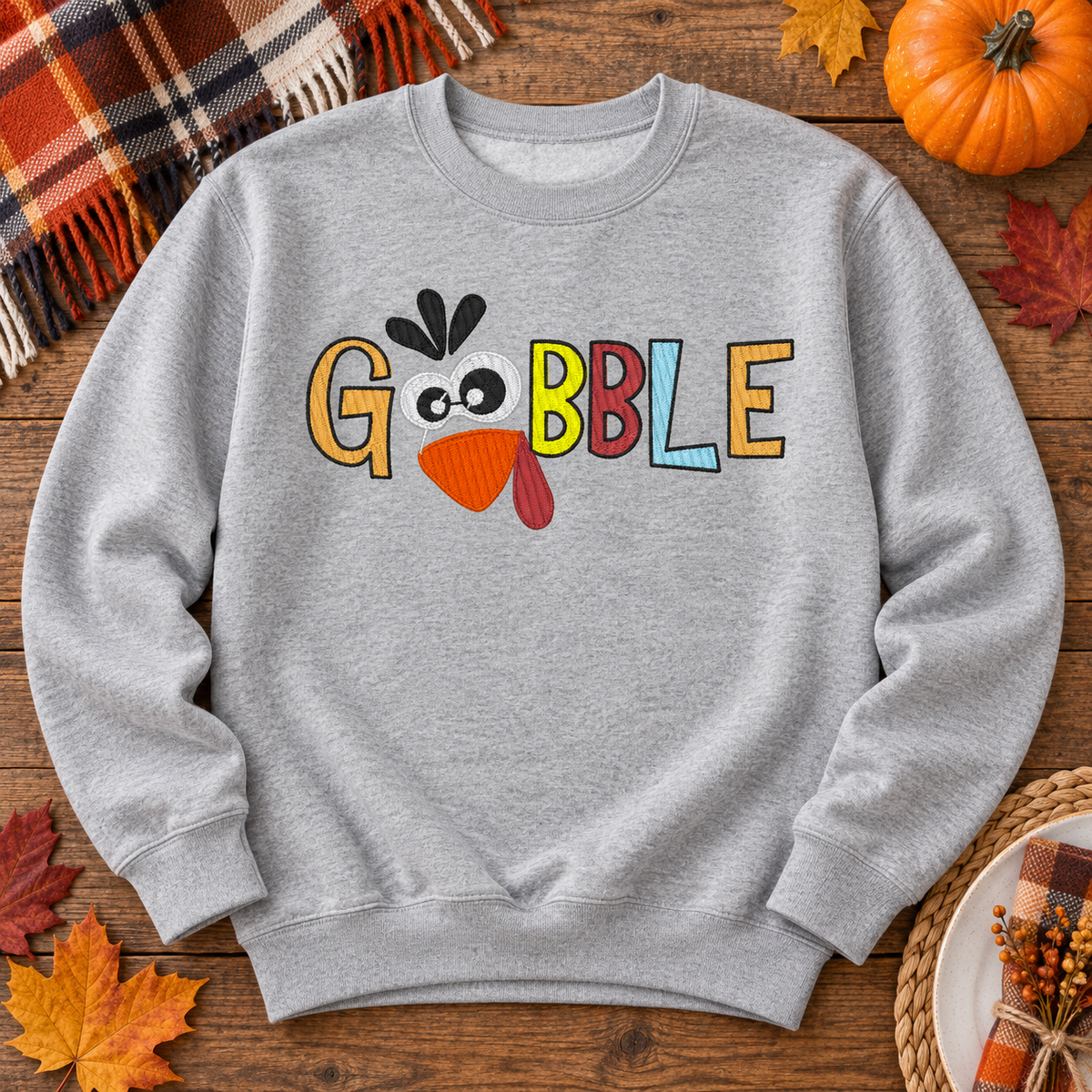 Sport Grey Gobble turkey embroidered sweatshirt flat lay with rustic fall styling