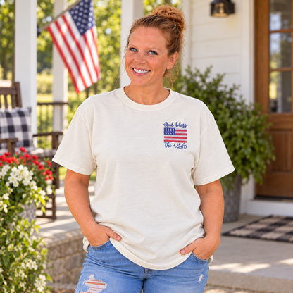 Samantha wearing an Ivory Comfort Colors tee with God Bless the USA left-chest embroidery
