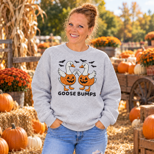 Woman wearing Sport Grey Goose Bumps embroidered Halloween sweatshirt at a pumpkin patch