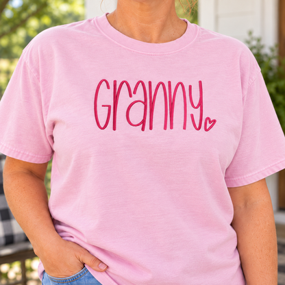 Close-up of raised dark rose Granny embroidery on a Blossom Comfort Colors tee