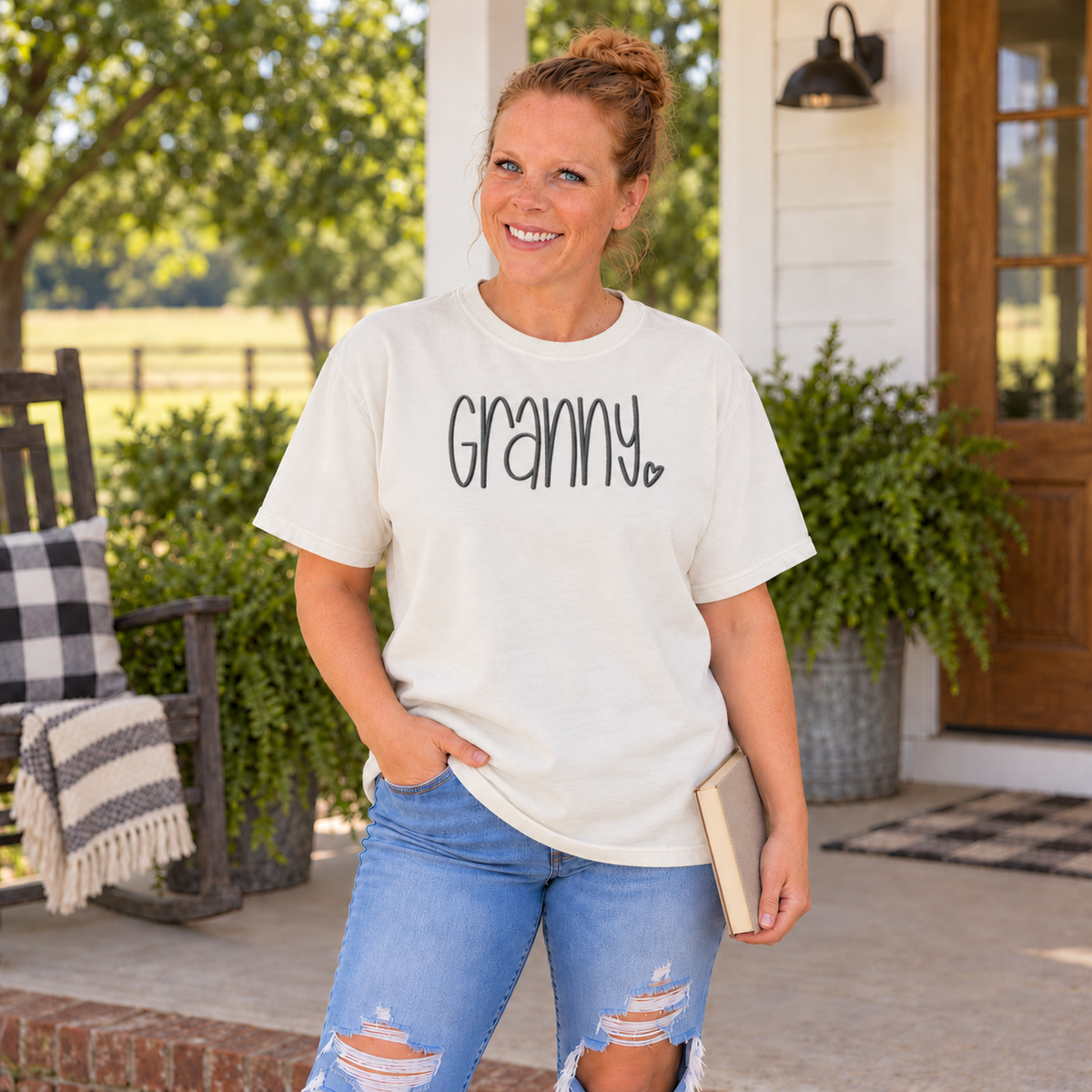 Samantha wearing an Ivory Comfort Colors tee with charcoal Granny embroidery
