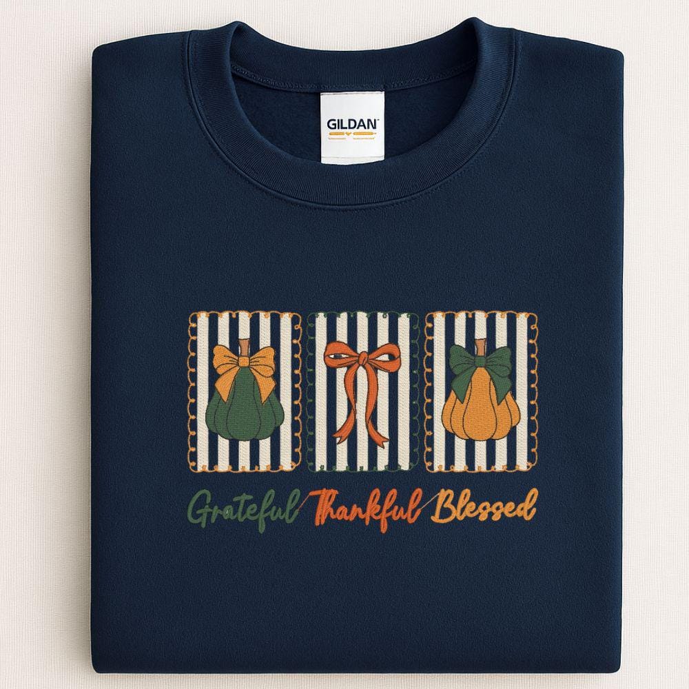 Folded navy Gildan sweatshirt showing Grateful Thankful Blessed embroidered design