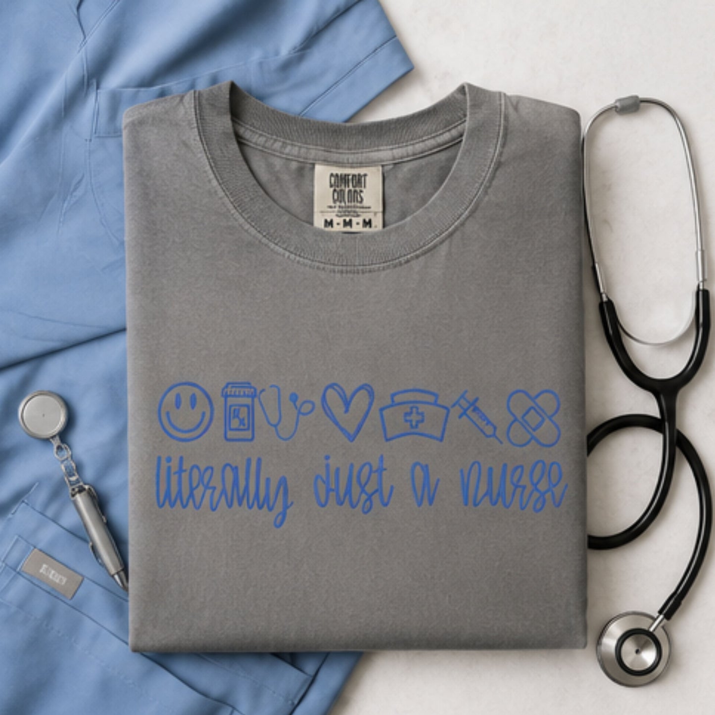 Embroidered Comfort Colors gray nursing t-shirt with blue stitched healthcare design