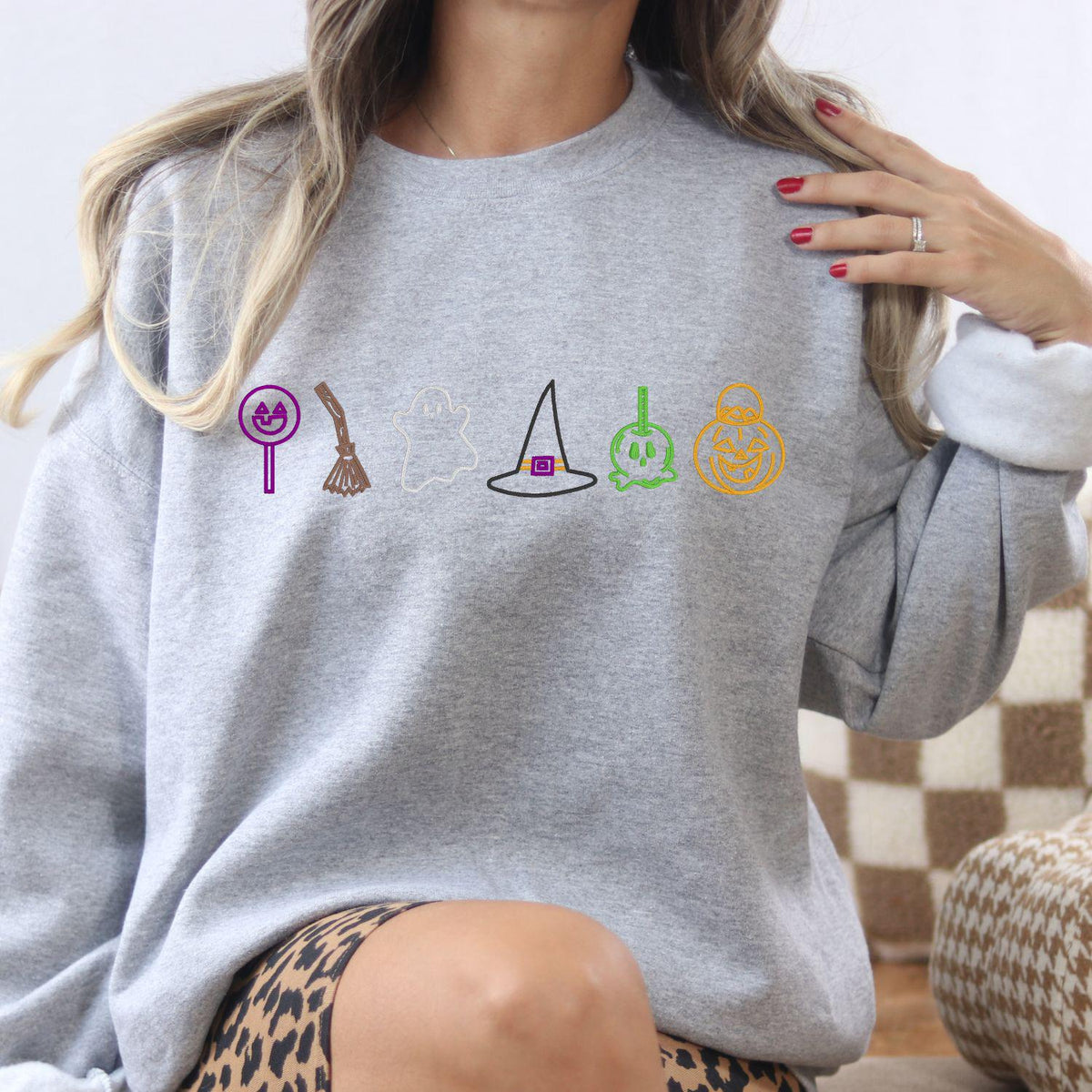 Sport gray Halloween candy ghost and witch hat sweatshirt modeled indoors