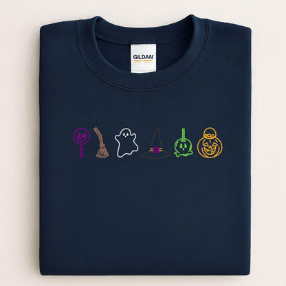 Navy sweatshirt with embroidered Halloween candy ghost witch hat and pumpkin icons folded flat