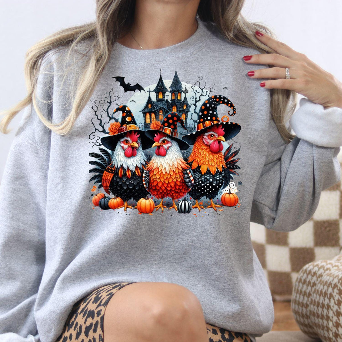 Sport gray Halloween chickens graphic sweatshirt modeled indoors