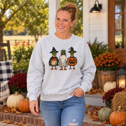 Woman wearing Ash Halloween Duck embroidered sweatshirt on a fall porch