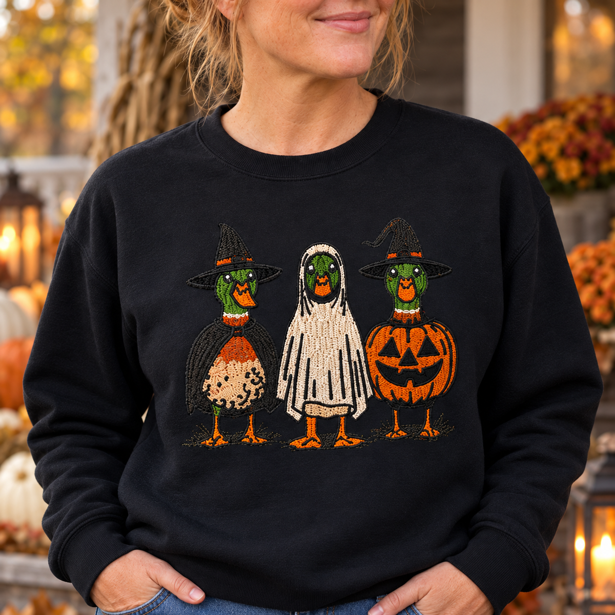 Close detail of raised Halloween Duck embroidery on a Black sweatshirt