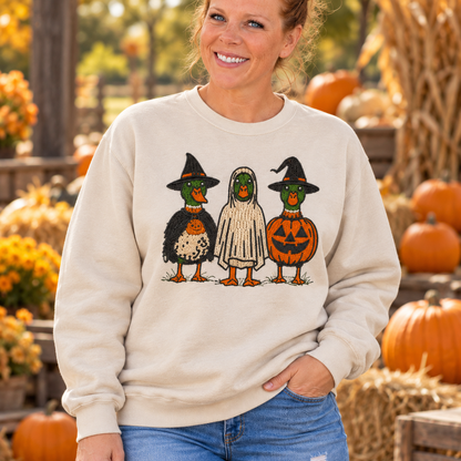 Close detail of raised Halloween Duck embroidery on a Sand sweatshirt