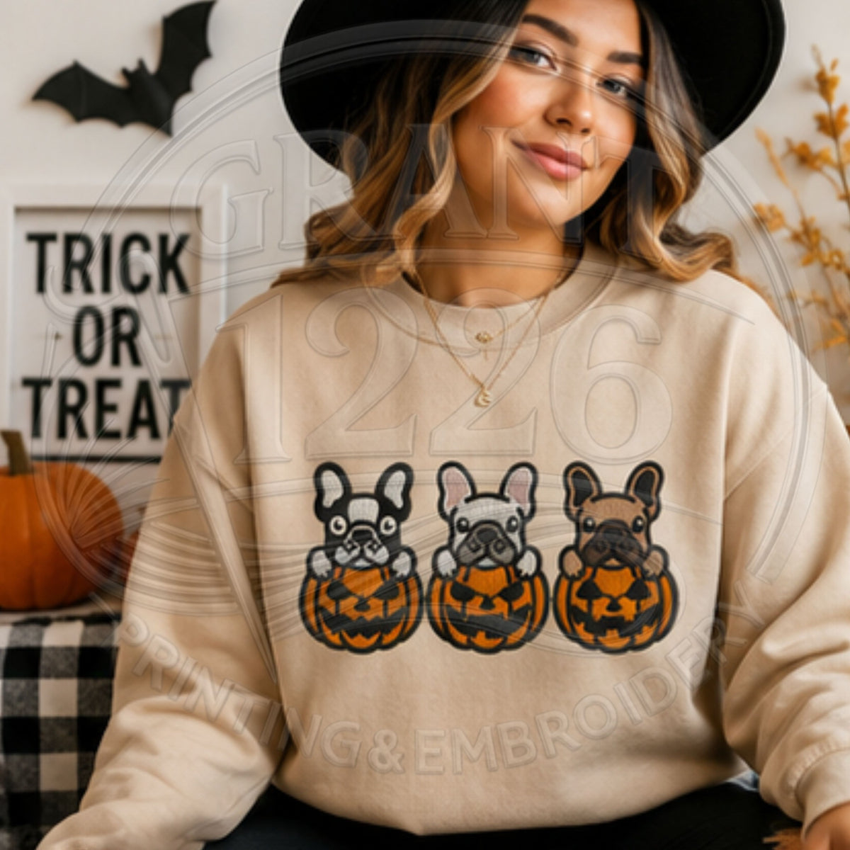 Adult wearing sand embroidered French bulldog pumpkin sweatshirt
