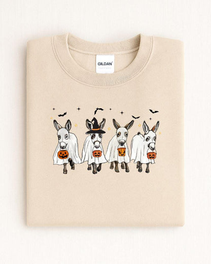 Sand Gildan Heavy Blend sweatshirt with four ghost donkeys carrying Halloween pumpkin buckets