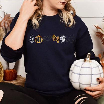 Navy Halloween icons embroidered sweatshirt with pumpkin, lifestyle view