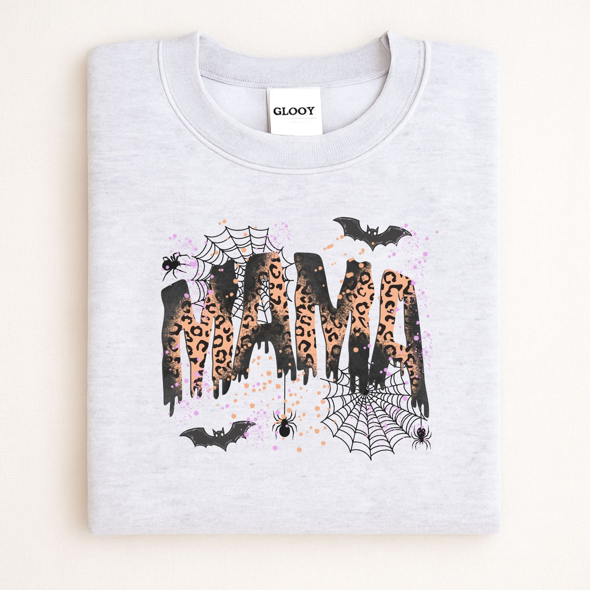 Folded Ash Gildan 18000 sweatshirt with spooky leopard print MAMA design