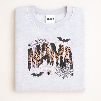Folded Ash Gildan 18000 sweatshirt with spooky leopard print MAMA design