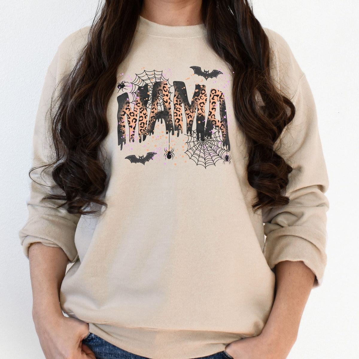 Sand Gildan 18000 heavyweight sweatshirt with leopard MAMA Halloween graphic on woman