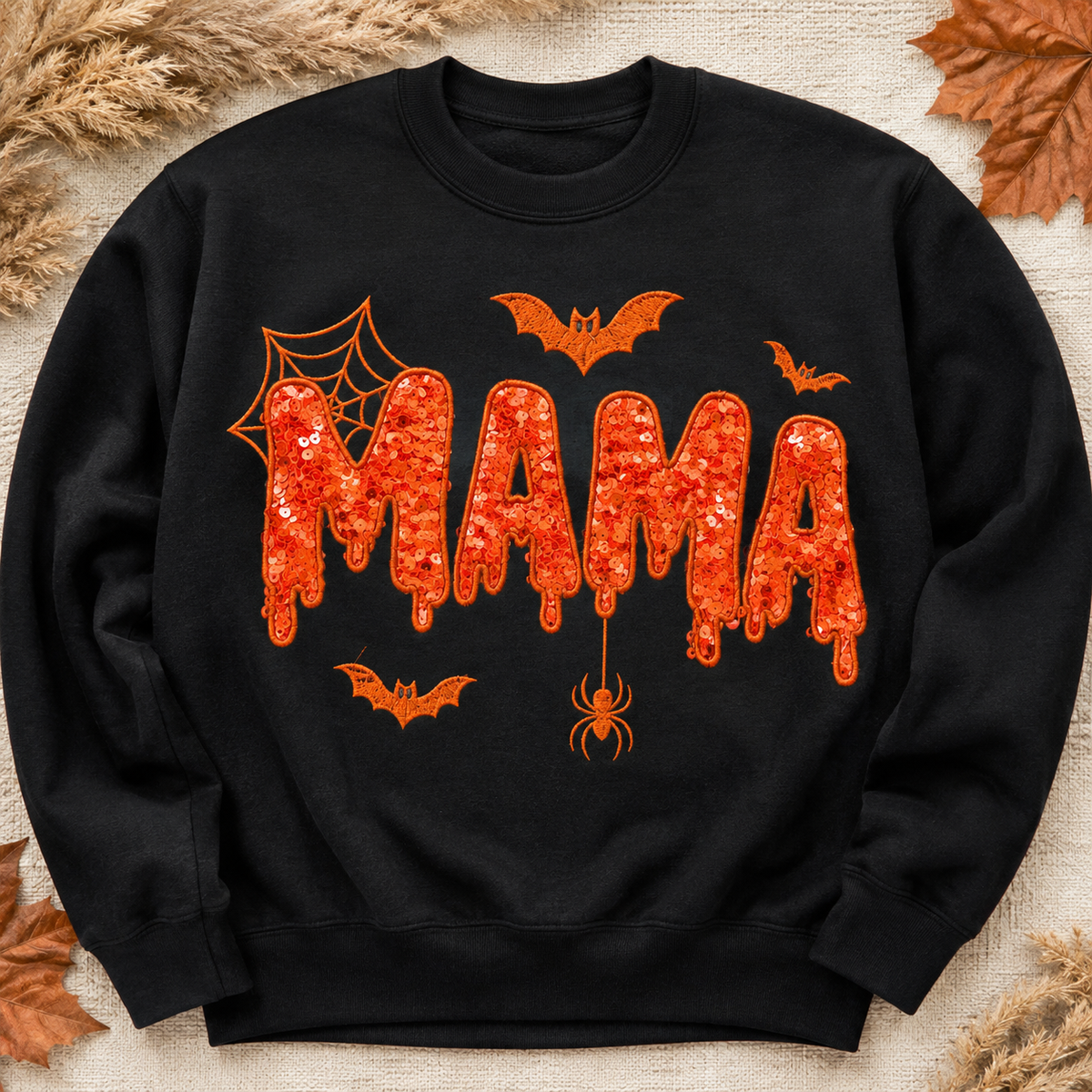 Digital color preview of Gildan Black Halloween MAMA sweatshirt with orange sequin appliqué and matching embroidery
