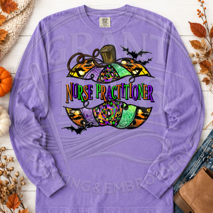 Violet Comfort Colors long sleeve Nurse Practitioner Halloween shirt with colorful pumpkin and bats graphic, fall flat lay.
