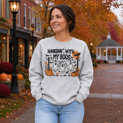 Woman wearing a Sport Grey Hanging With My Boos embroidered Halloween sweatshirt with hanging ghosts