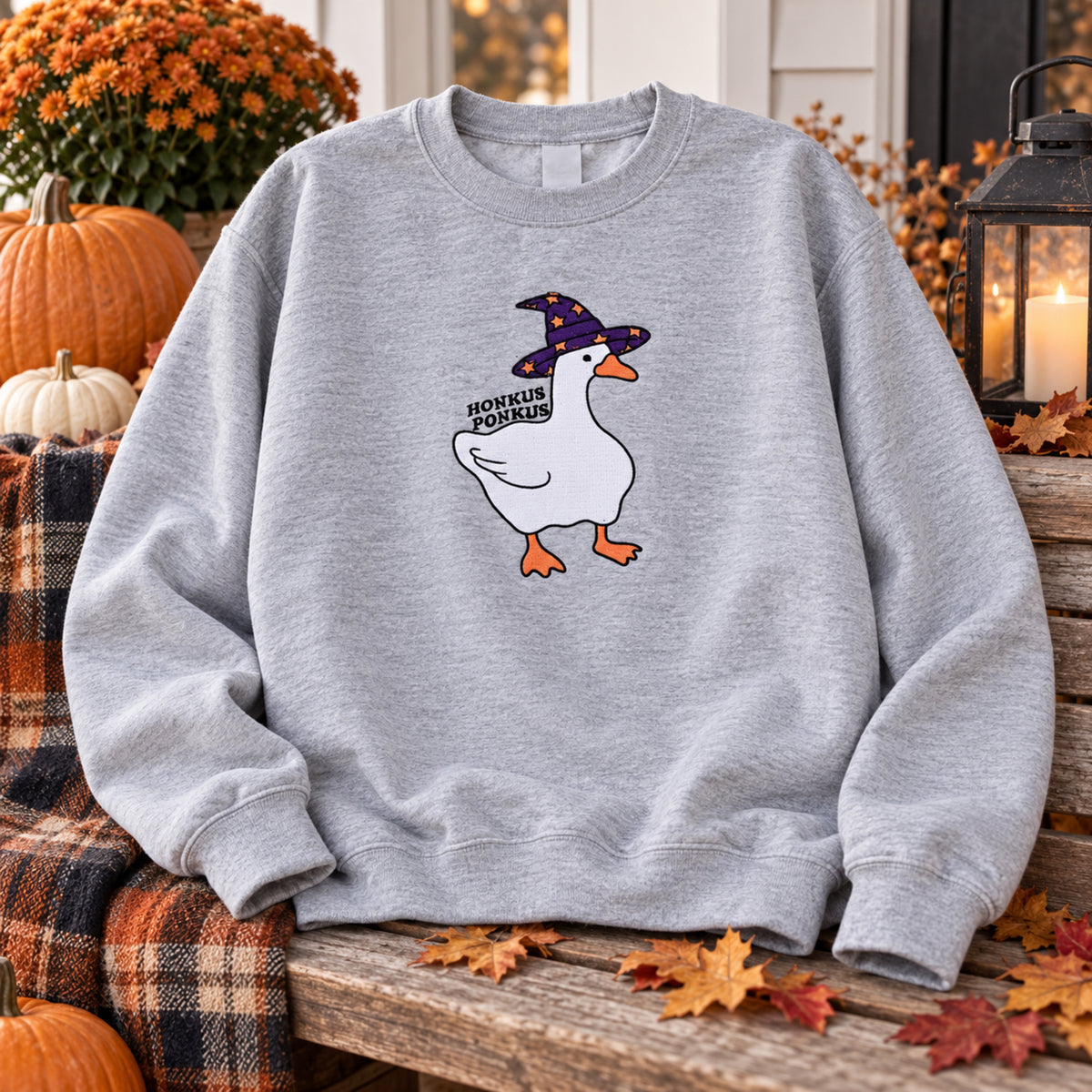 Sport Grey Honkus Ponkus goose sweatshirt styled on an autumn porch
