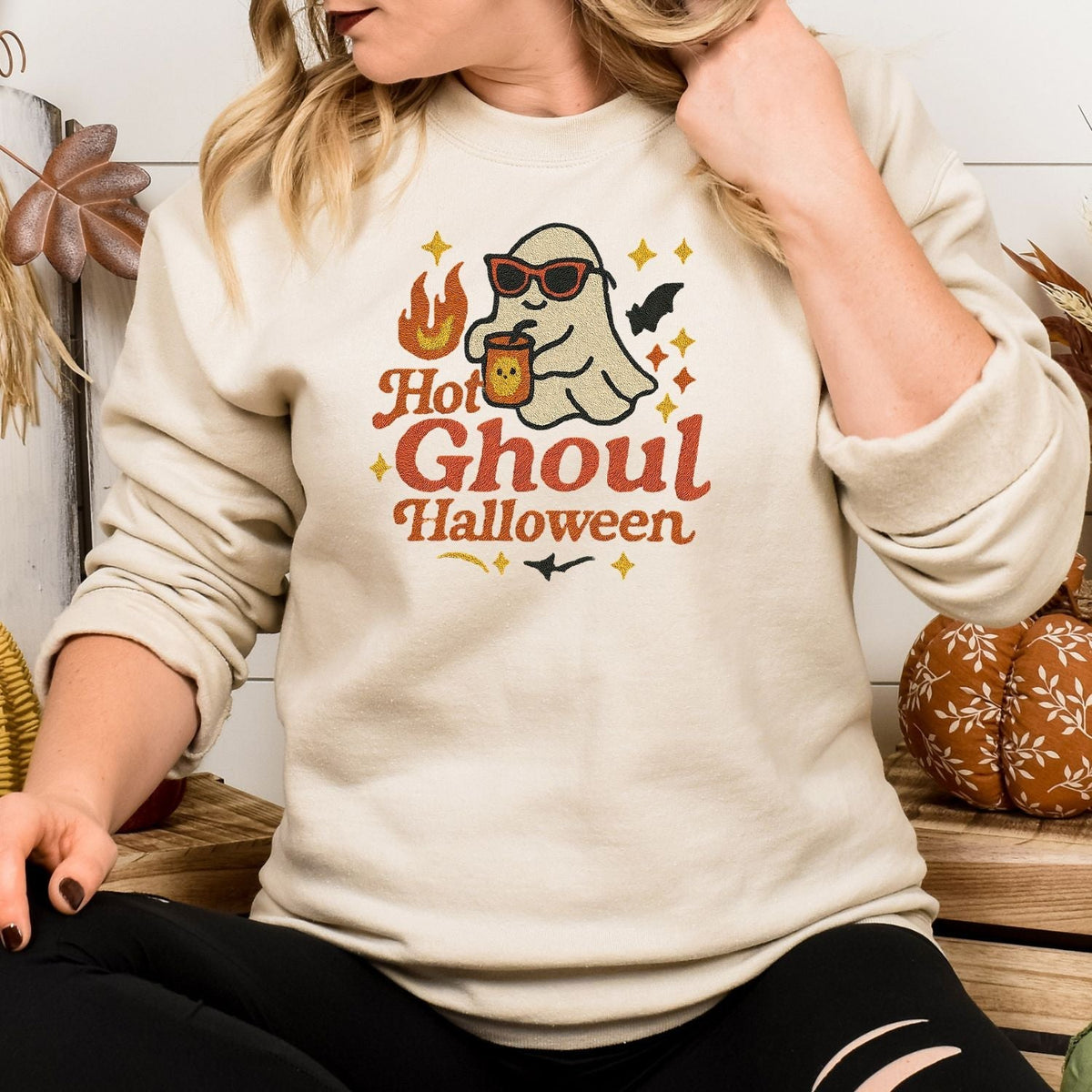Woman wearing a Sand Hot Ghoul embroidered sweatshirt with sunglasses ghost design