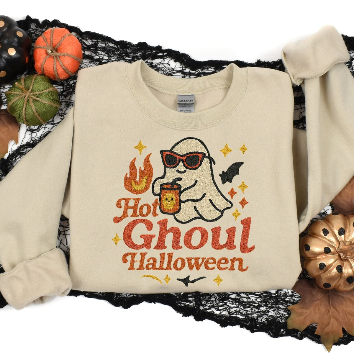 Sand Hot Ghoul embroidered sweatshirt styled with Halloween pumpkins