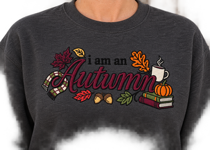 Close-up of I Am an Autumn multicolor embroidery thread detail on a crewneck sweatshirt