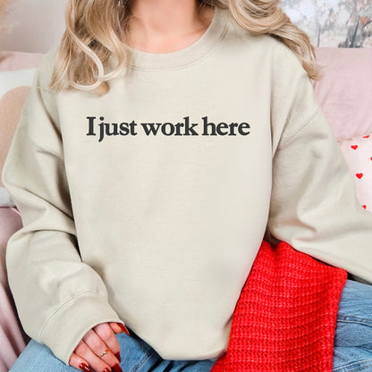 Sand I Just Work Here embroidered sweatshirt shown in a casual workplace-humor outfit