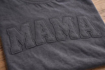 Close-up of stitched applique lettering on custom Comfort Colors shirt