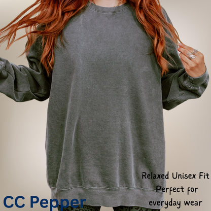 Model wearing blank Comfort Colors sweatshirt showing relaxed unisex fit